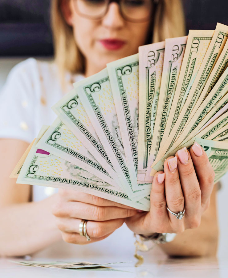 Woman Fanning out Money in Hand Woman Fanning out Money in Hand